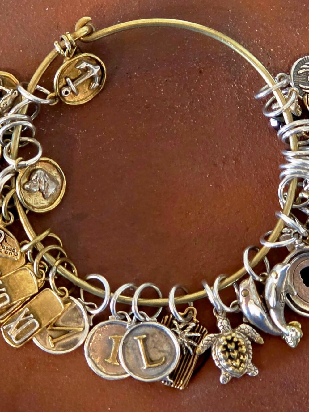 WAXING POETIC BRACELET WITH 30 RARE, COLLECTIBLE CHARMS